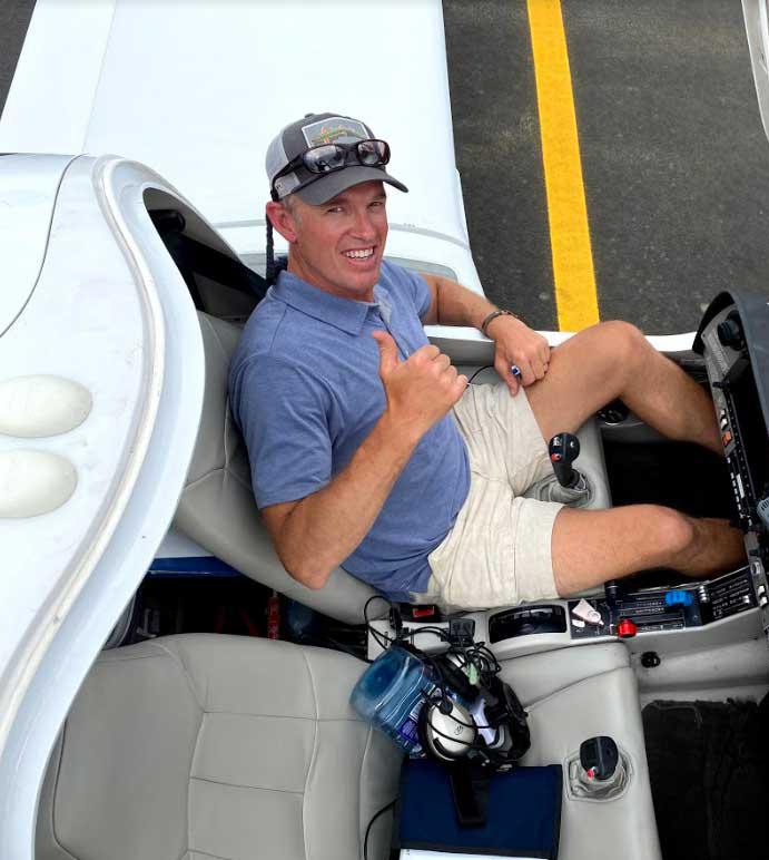 Tom Filippini piloting his plane